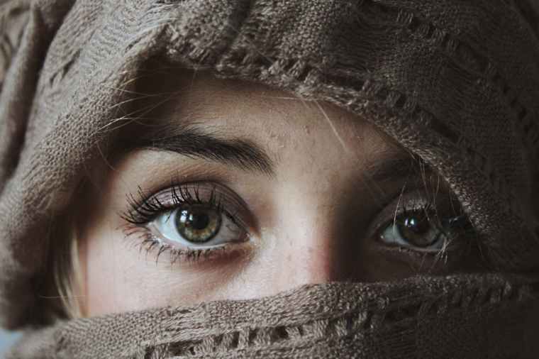 photo of person covered with brown textile